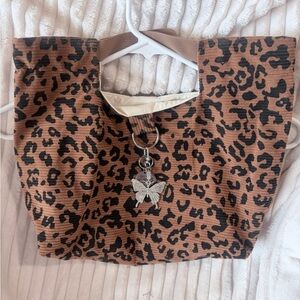 Handmade clutch bag in cheetah print. Lined.